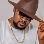 stylish man with hat and gold chain