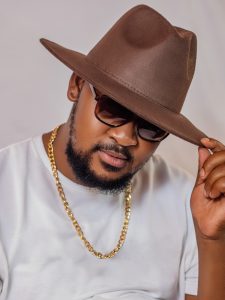 stylish man with hat and gold chain