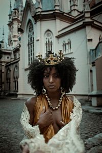woman with gold crown and necklace