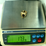 17.3 gram gold ring on scale
