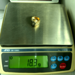 18.3 gram gold ring on scale
