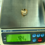 18.4 gram gold ring on scale