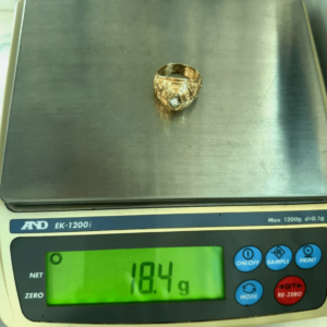 18.4 gram gold ring on scale