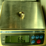 6.6 gram gold ring on scale