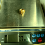 7.7 gram gold ring on scale