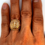 us navy gold ring on hand