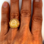 us navy gold ring on hand