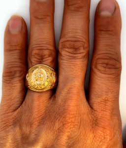 us navy gold ring on hand