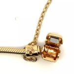 closeup of gold charm bracelet