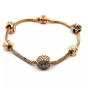 8.5in 14k gold charm bracelet